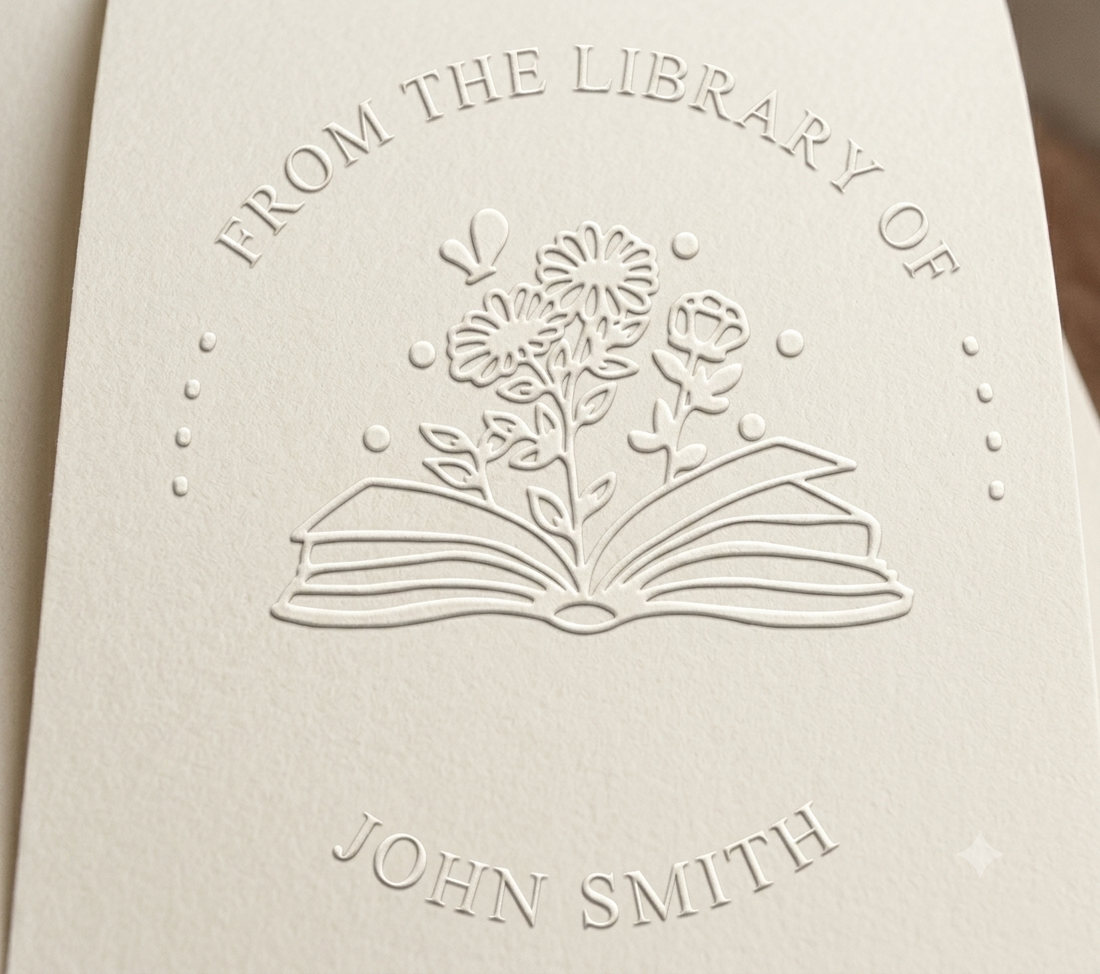 Custom circular book embosser seal pressed onto textured paper showing floral book design with text From the Library of John Smith.